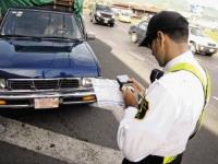 A Costarican traffic cop writing a ticket